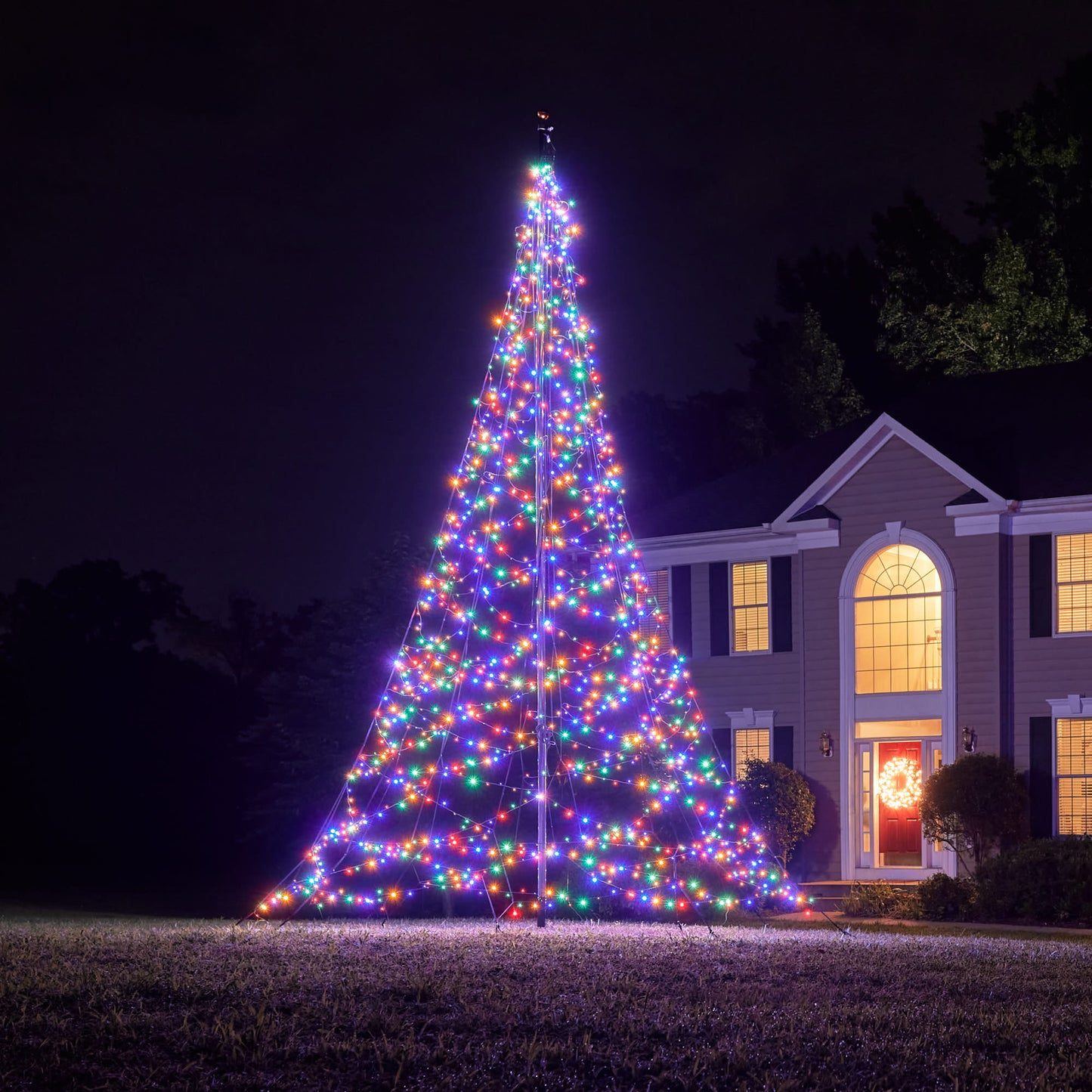 Massive Outdoor Conical Tree Structure Made of Multicolor LED Lights Massive Outdoor Conical Tree Structure Made of Multicolor LED Lights — Christmas Tree with Colored Lights