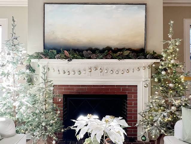 Traditional Living Room with Flocked Christmas Trees Flanking a White Brick Fireplace Traditional Living Room with Flocked Christmas Trees Flanking a White Brick Fireplace — White Christmas Decor