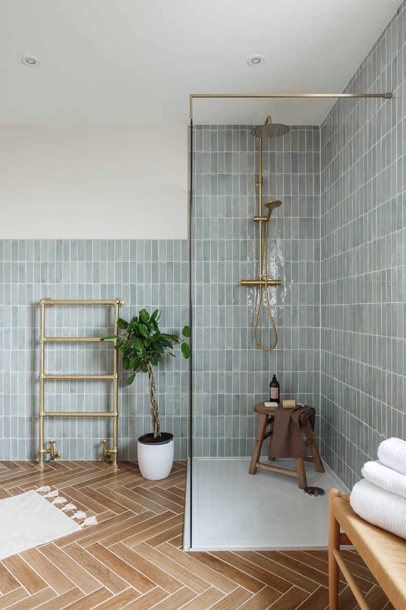 Elegant Modern Shower with Light Blue-Green Tiles and Brass Accents — Shower Room Ideas
