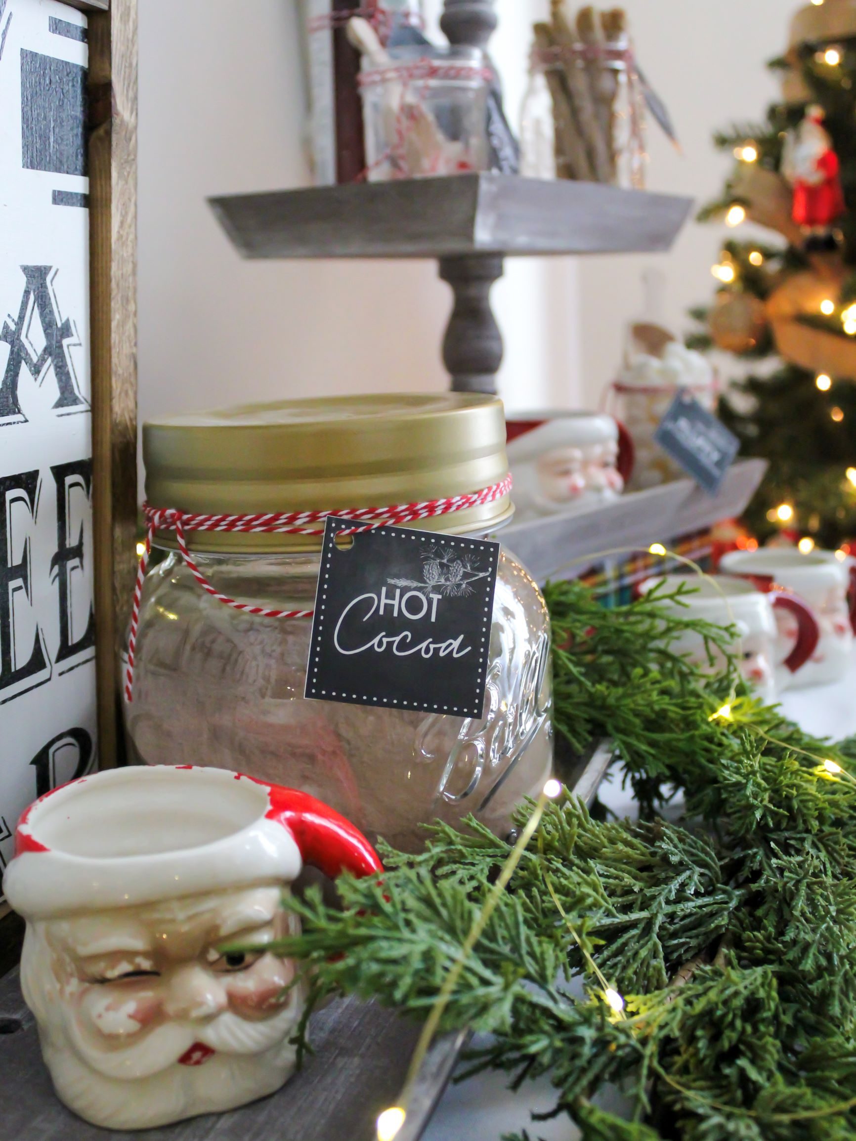 Rustic Kitchen Hot Cocoa Bar with Santa Mugs and Garland — Christmas Hot Cocoa Bar