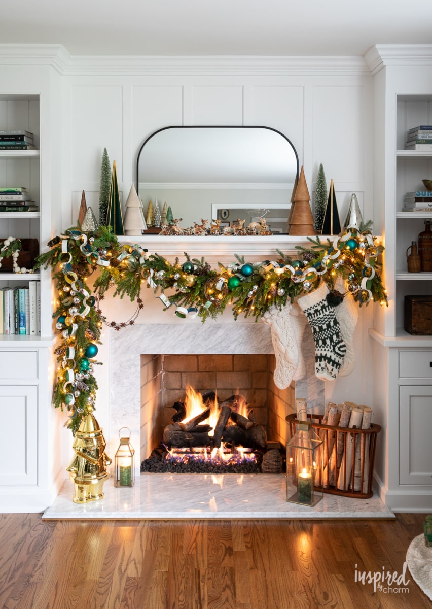Marble Fireplace with Teal Ornaments and Symmetrical Shelving Marble Fireplace with Teal Ornaments and Symmetrical Shelving — Christmas Fireplace Decor
