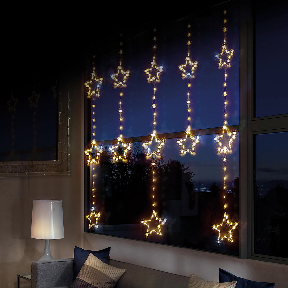 Vertical Star-Shaped Fairy Lights Across a Living Room Window — Christmas Fairy Lights Window