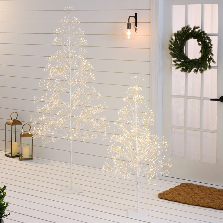 Inviting Outdoor Porch with Two White Pre-Lit LED Trees Inviting Outdoor Porch with Two White Pre-Lit LED Trees — White Christmas Decor