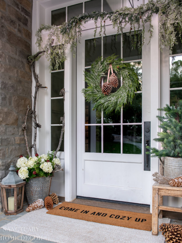 Serene Entryway with Frosted Pine Wreath and Rustic Lanterns — Farmhouse Christmas Porch