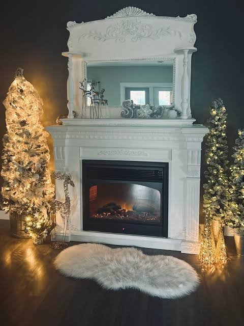 Glam Living Room with Illuminated Christmas Trees Flanking Fireplace Glam Living Room with Illuminated Christmas Trees Flanking Fireplace — Christmas Fireplace Decor