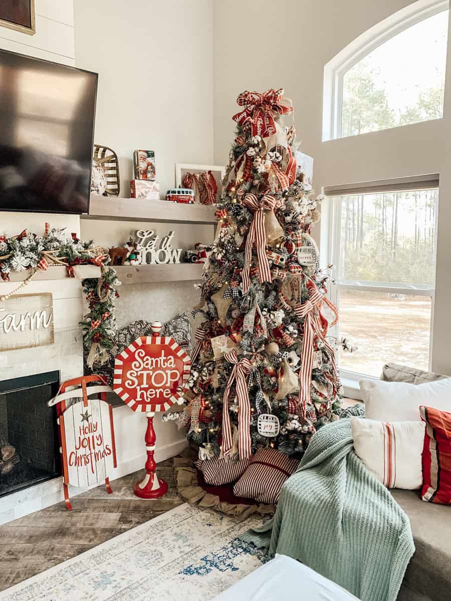 Farmhouse Festive: Red and White Ribbon on Tall Flocked Tree Farmhouse Festive: Red and White Ribbon on Tall Flocked Tree — Flocked Christmas Tree Decor