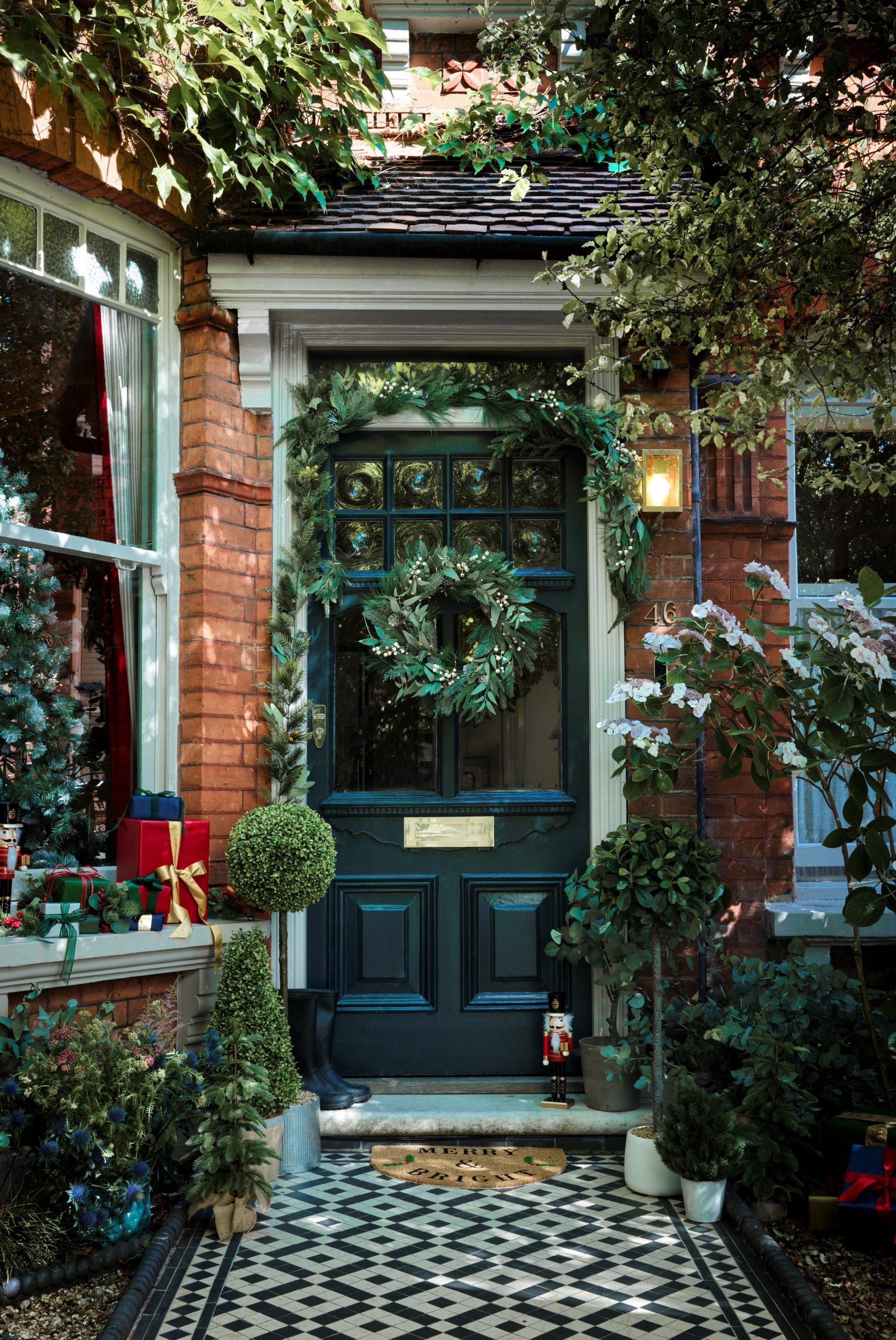 Elegant Doorway with Nutcracker and Topiary Trees — Christmas House Exterior Decor