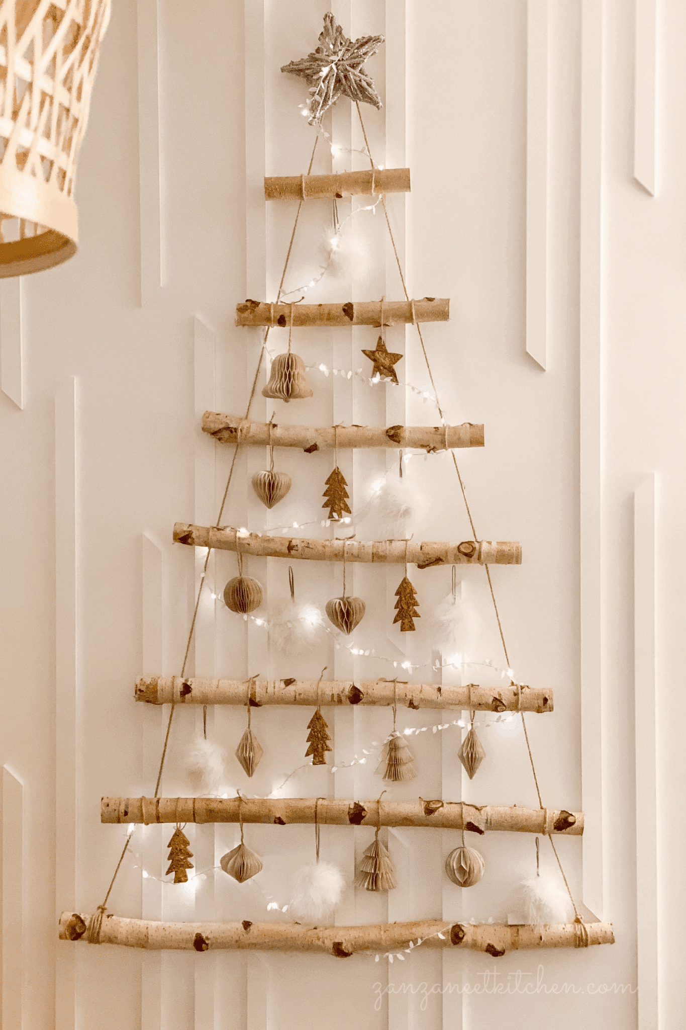 Interior Space Boho Hanging Branch Wall Tree with Paper Ornaments — Alternative Christmas Trees