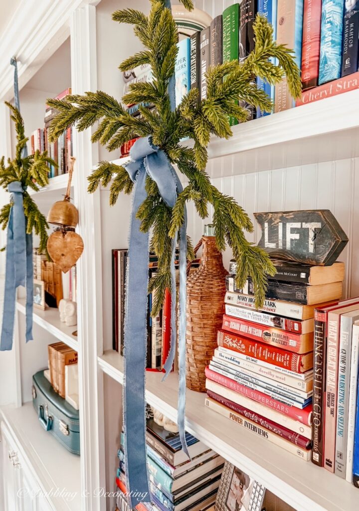 Eclectic Shelf Decor with Pine Branches and Lanterns Eclectic Shelf Decor with Pine Branches and Lanterns — Christmas Shelf Decor