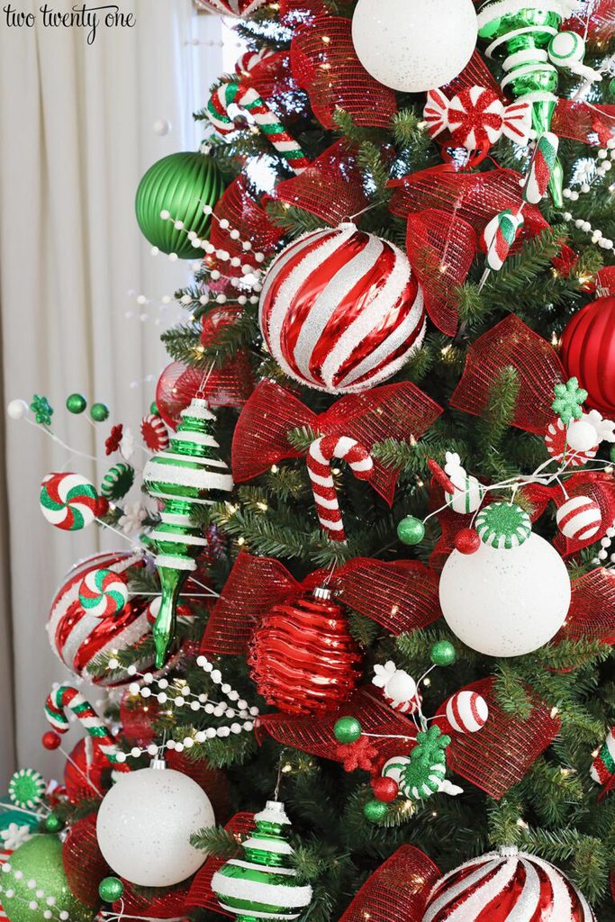 Close-up of a Christmas Tree with Bold Red and Green Ornaments Close-up of a Christmas Tree with Bold Red and Green Ornaments — Red and Green Christmas Decor