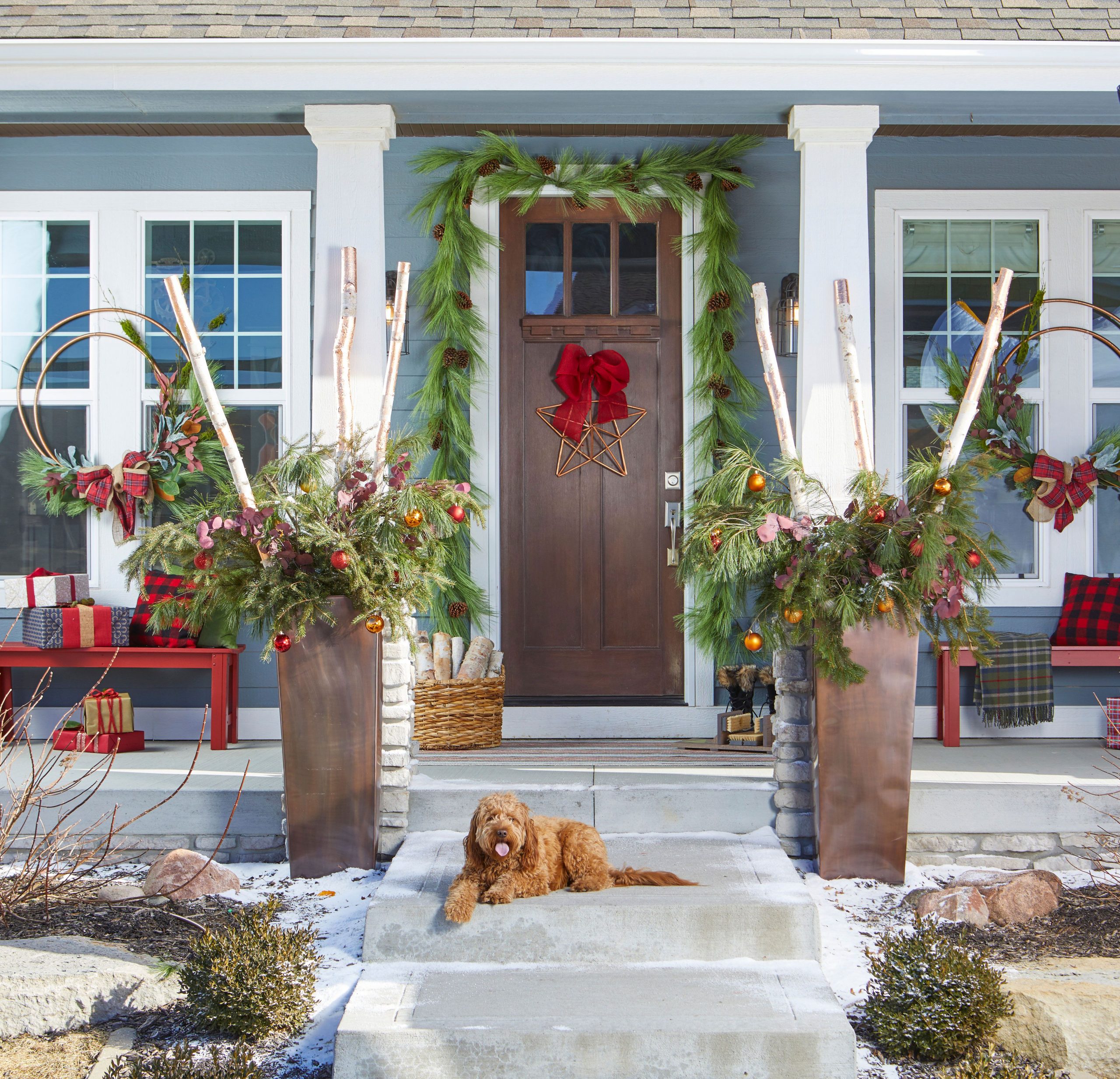 Farmhouse Porch with Large Greenery and Festive Red Benches — Farmhouse Christmas Decor