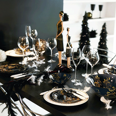 Contemporary Art Deco Table Setting with Gold Accents and Feathers — New Years Eve Party Decor