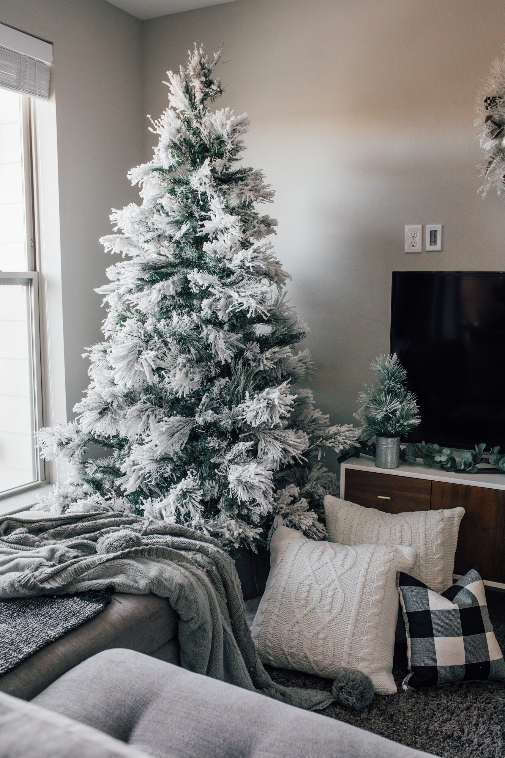 Cozy Modern Living: Flocked Tree with Knit and Plaid Pillows Cozy Modern Living: Flocked Tree with Knit and Plaid Pillows — Flocked Christmas Tree Decor