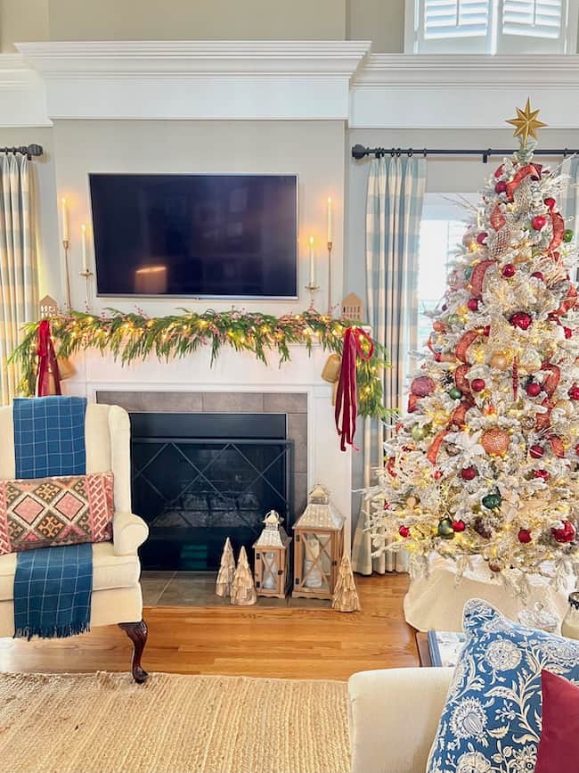 Living Room Traditional Flocked Tree with Red, Gold, and Green Ornaments by Fireplace — Christmas Tree Color Schemes