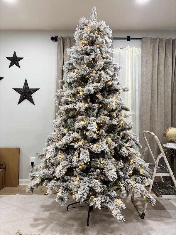 Imposing Presence: Tall, Fully Flocked Artificial Christmas Tree Imposing Presence: Tall, Fully Flocked Artificial Christmas Tree — Flocked Christmas Tree Decor