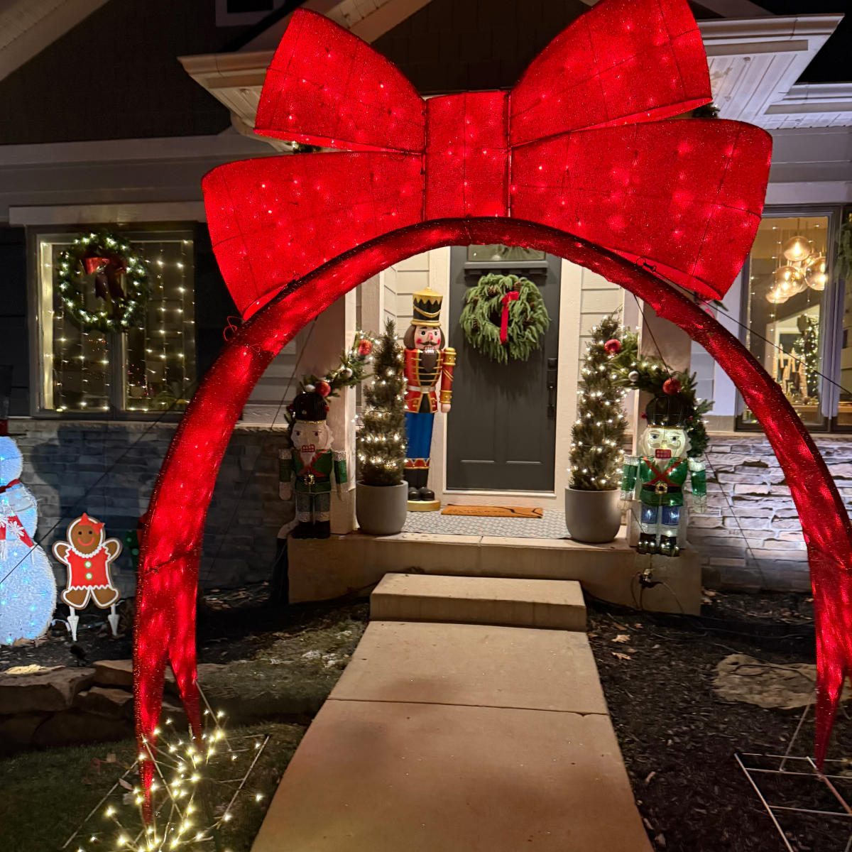 Whimsical Red Bow Archway Entrance — Christmas Light Display Ideas