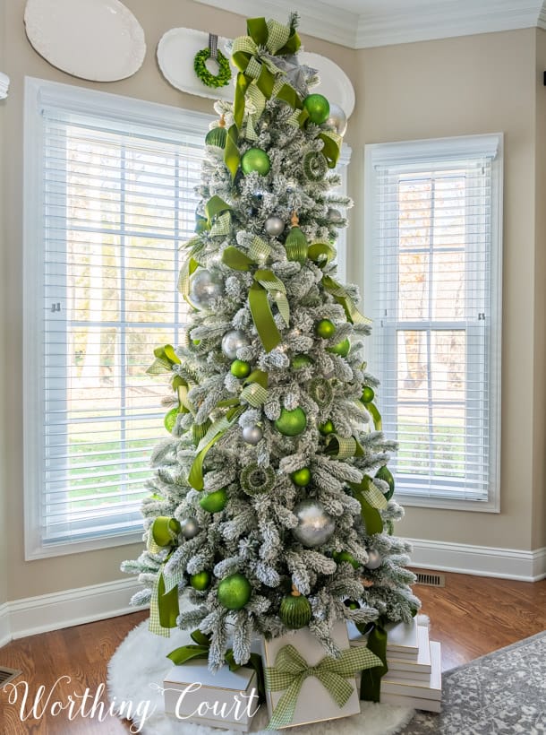 Cohesive Green Ribbon and Silver Baubles on a Flocked Tree — Elegant Christmas Tree
