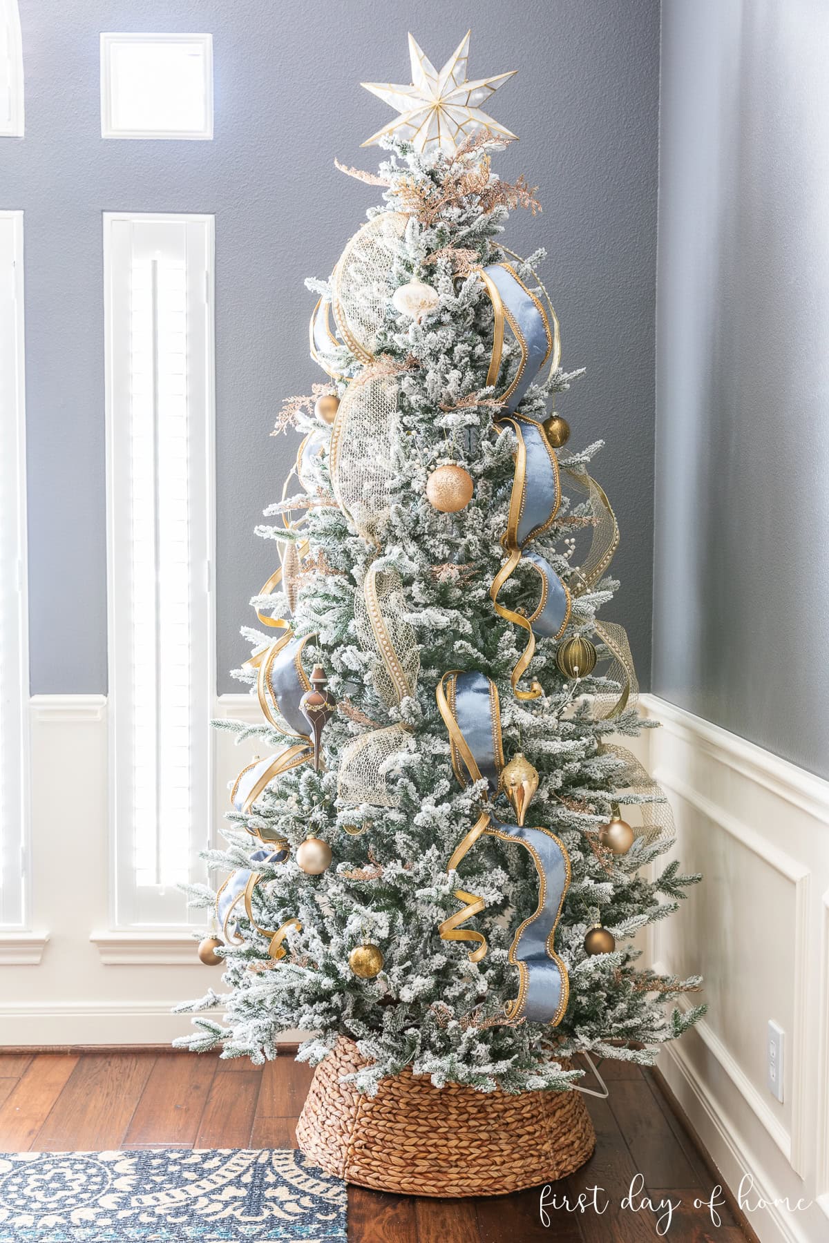 Modern Flocked Tree with Blue Ribbon and Gold Baubles — Christmas Tree Decorating
