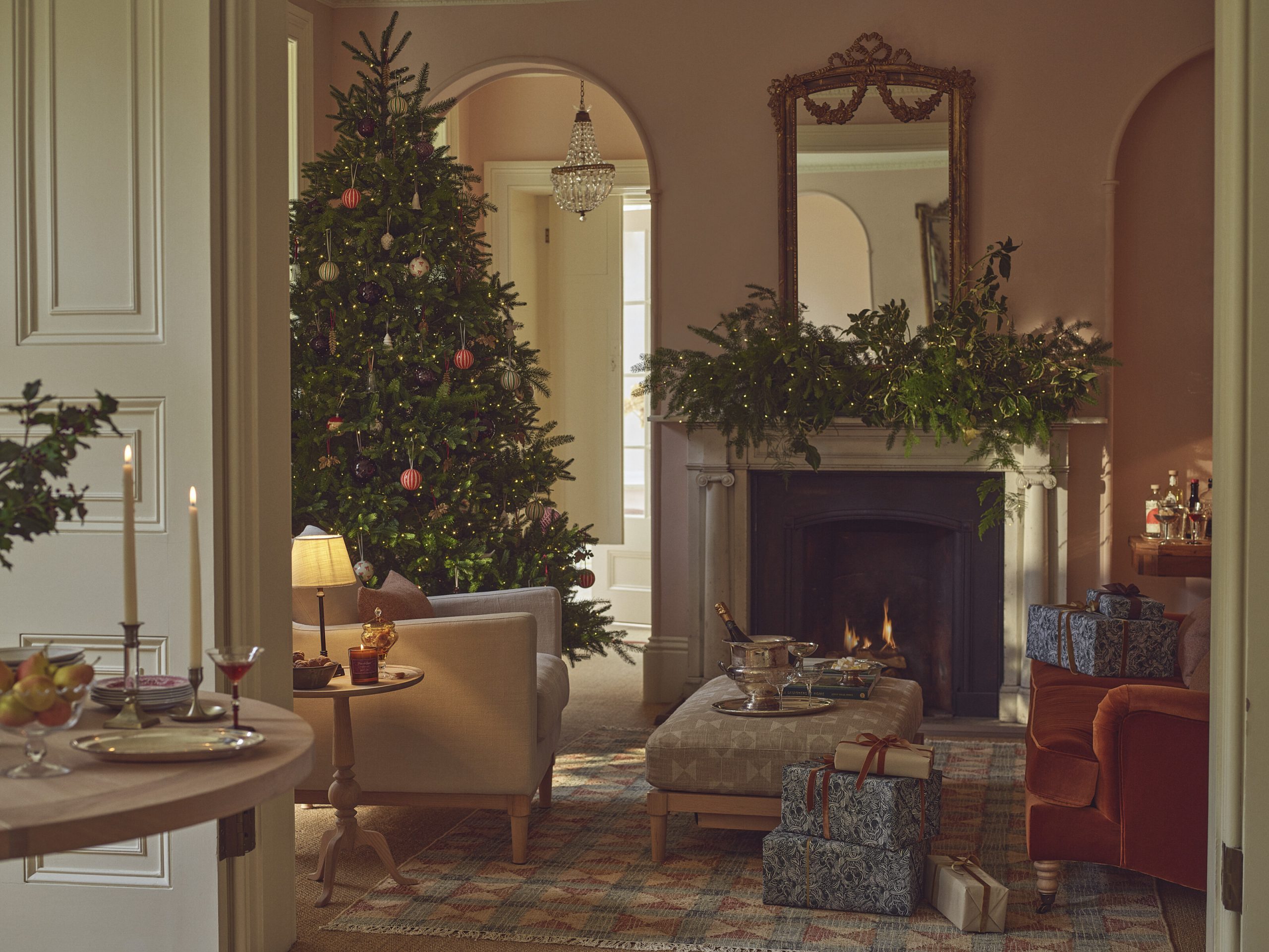 Elegant Living Room with Jewel-Toned Ornaments and Velvet Armchairs Elegant Living Room with Jewel-Toned Ornaments and Velvet Armchairs — christmas decor trends 2026