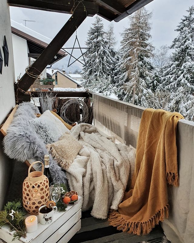 Hygge Balcony with Plush Blankets and Lanterns — Christmas Balcony Decor