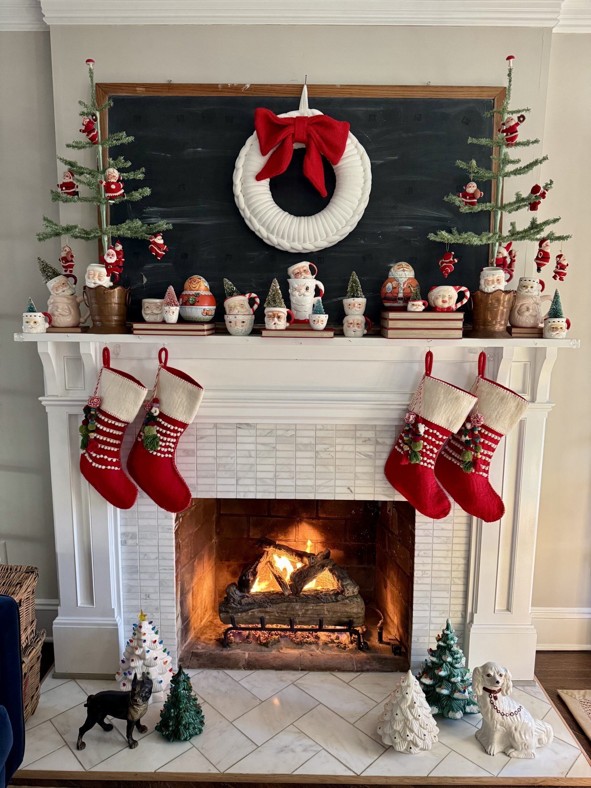 Traditional White Marble Mantel with Santa Figures Traditional White Marble Mantel with Santa Figures — Christmas Mantel Decor