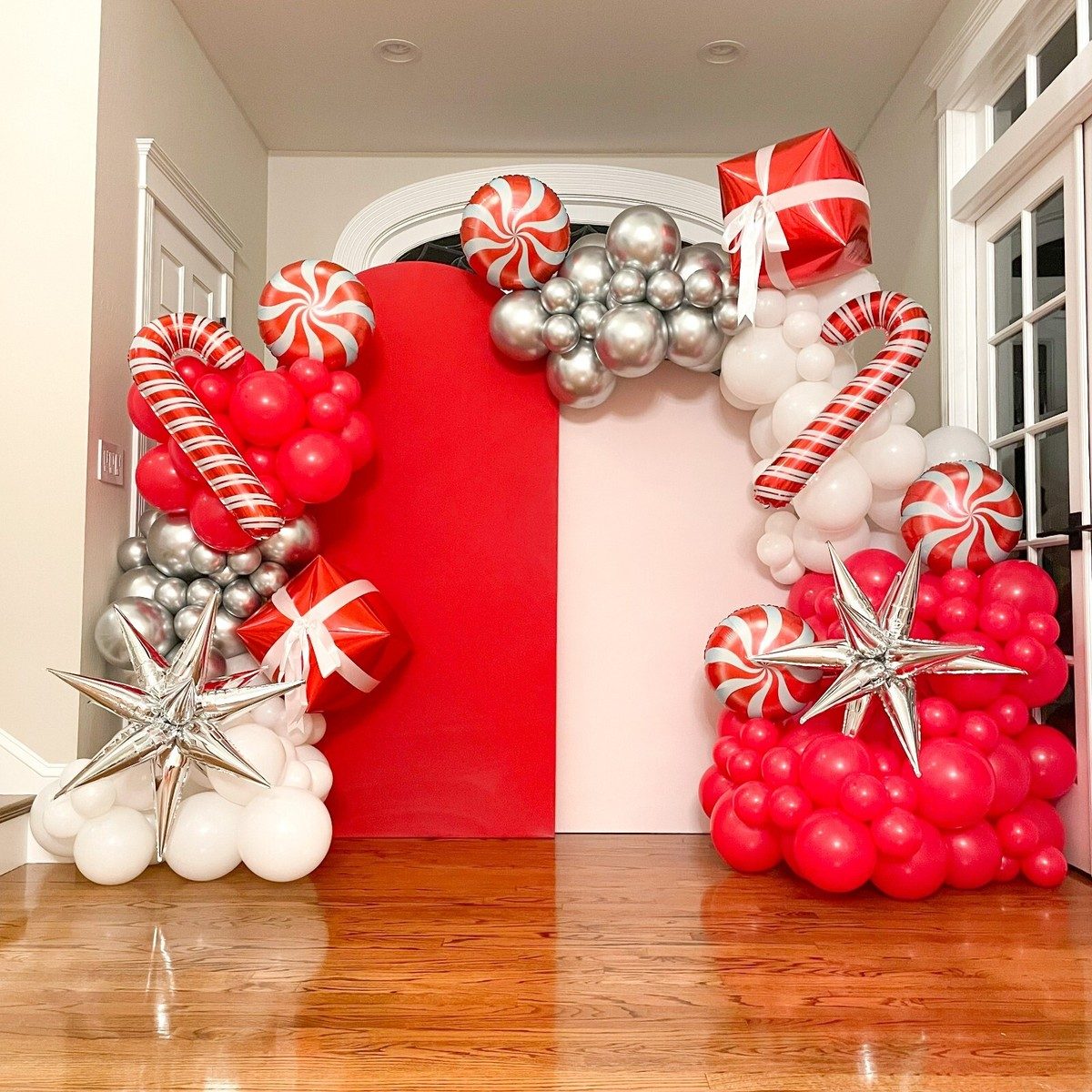 Large Red, White, and Silver Balloon Garland Framing an Entryway Large Red, White, and Silver Balloon Garland Framing an Entryway — Christmas Balloon Garland