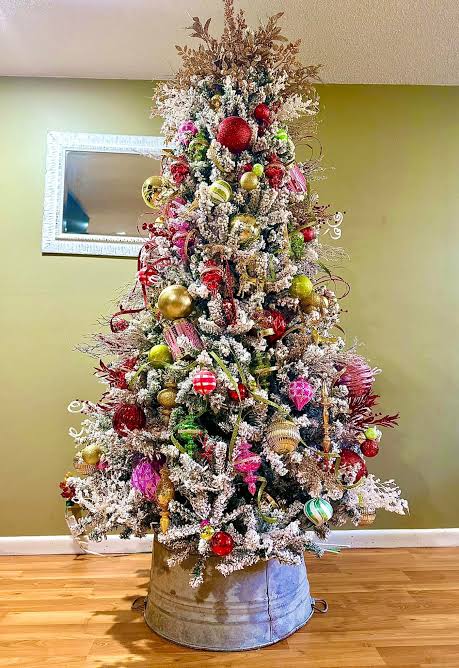 Eclectic Flocked Tree with Pink, Gold, Red, Green, and Lime Ornaments — Christmas Tree Color Schemes