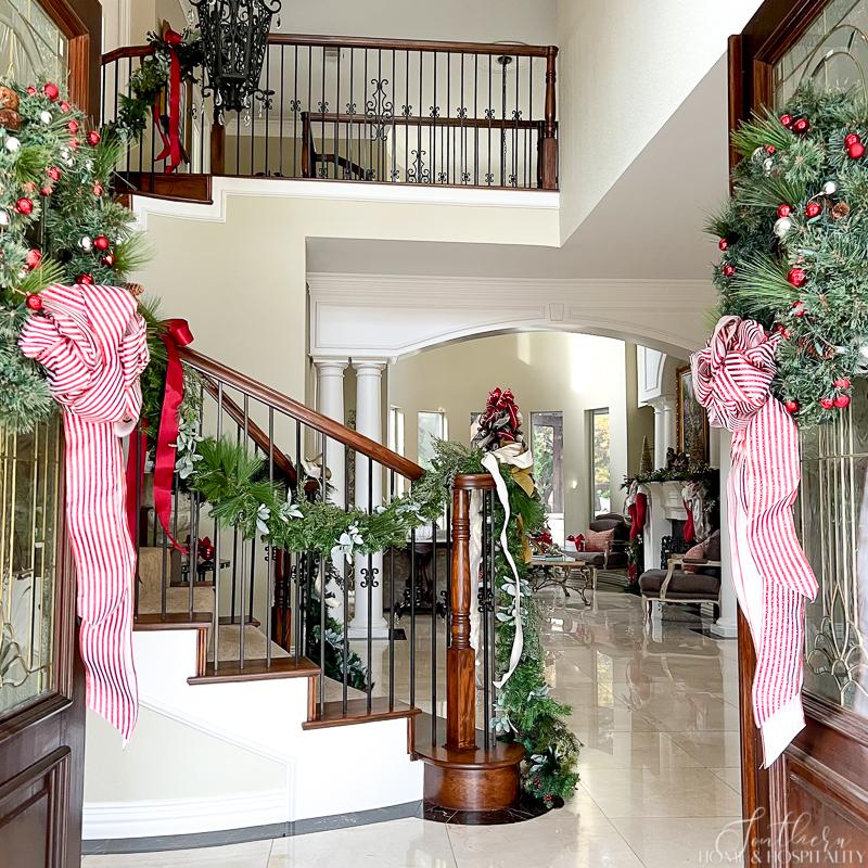 French Country Foyer with Garland and Wreaths French Country Foyer with Garland and Wreaths — Christmas Staircase Decor