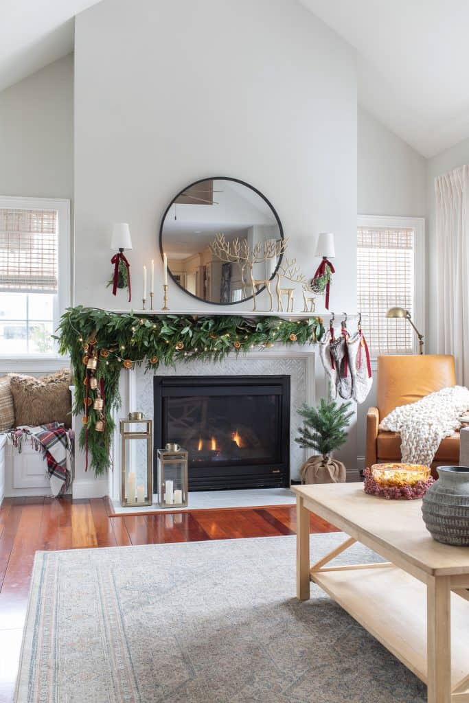 Transitional White Marble Fireplace with Gold Reindeer and Plaid Accents Transitional White Marble Fireplace with Gold Reindeer and Plaid Accents — Christmas Fireplace Decor