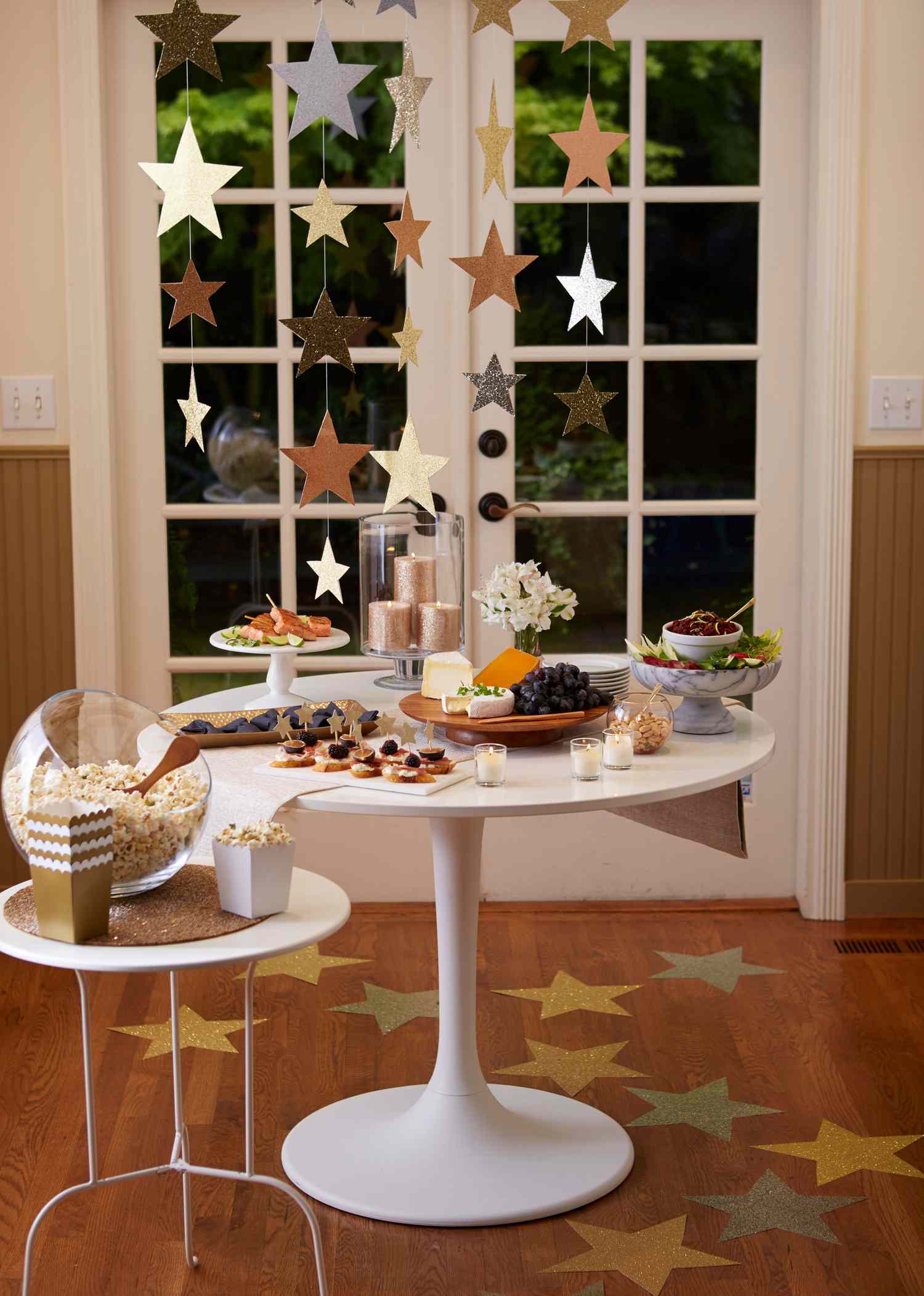 Festive Dining Area with Cascading Star Garlands and Glittery Accents — New Years Eve Party 2027