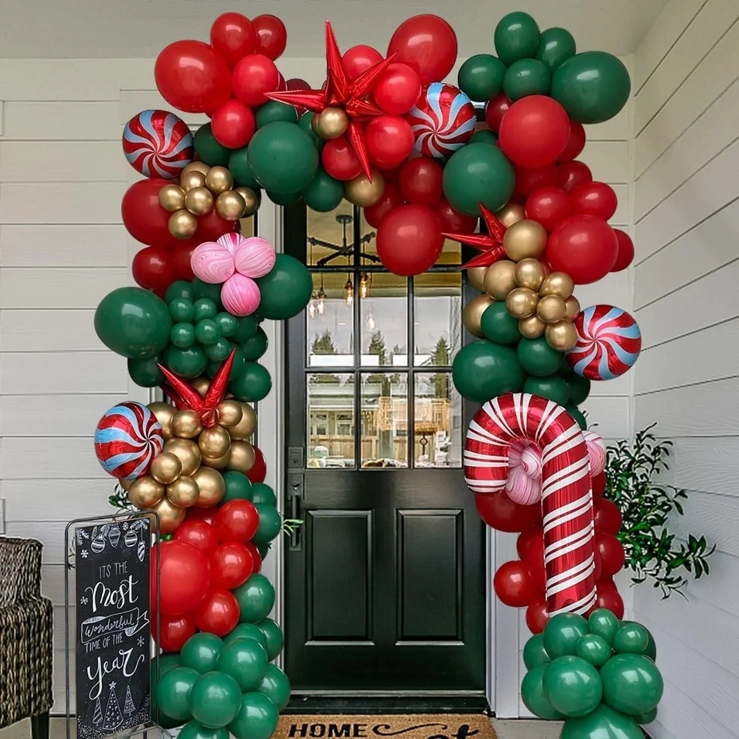 Festive Outdoor Christmas Balloon Garland Arching Over a Front Door Festive Outdoor Christmas Balloon Garland Arching Over a Front Door