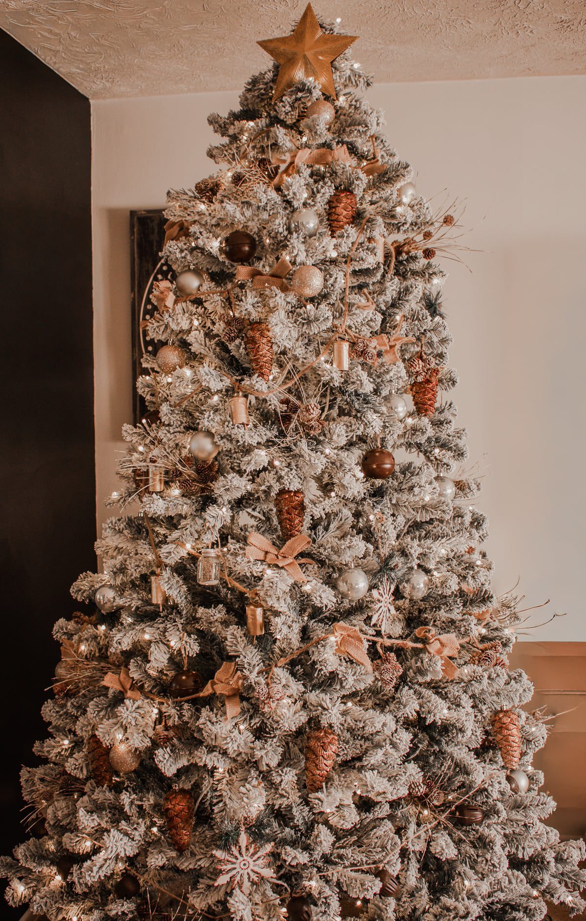 Flocked Christmas Tree with Pinecones and Star Topper Flocked Christmas Tree with Pinecones and Star Topper — christmas decor trends 2026
