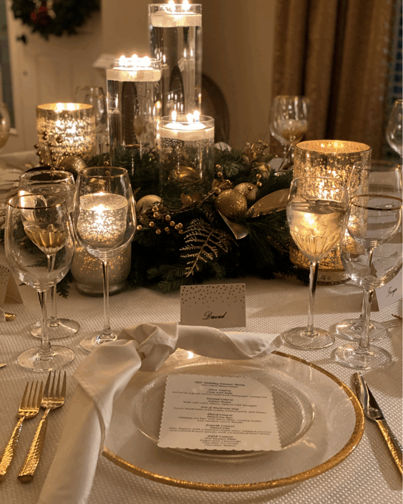 Elegant Table Setting with Gold Charger Plates and Greenery Centerpiece — Christmas Party Decor