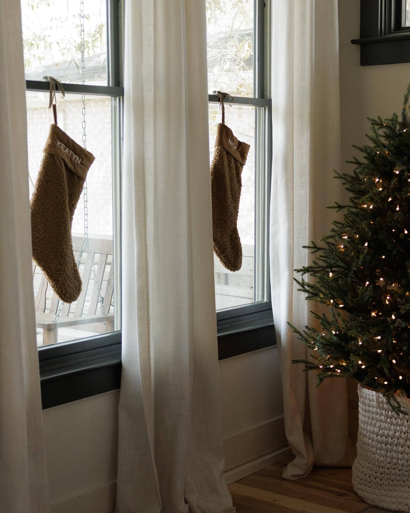Fuzzy Stockings Hung on Window Frame — Christmas Stockings Display