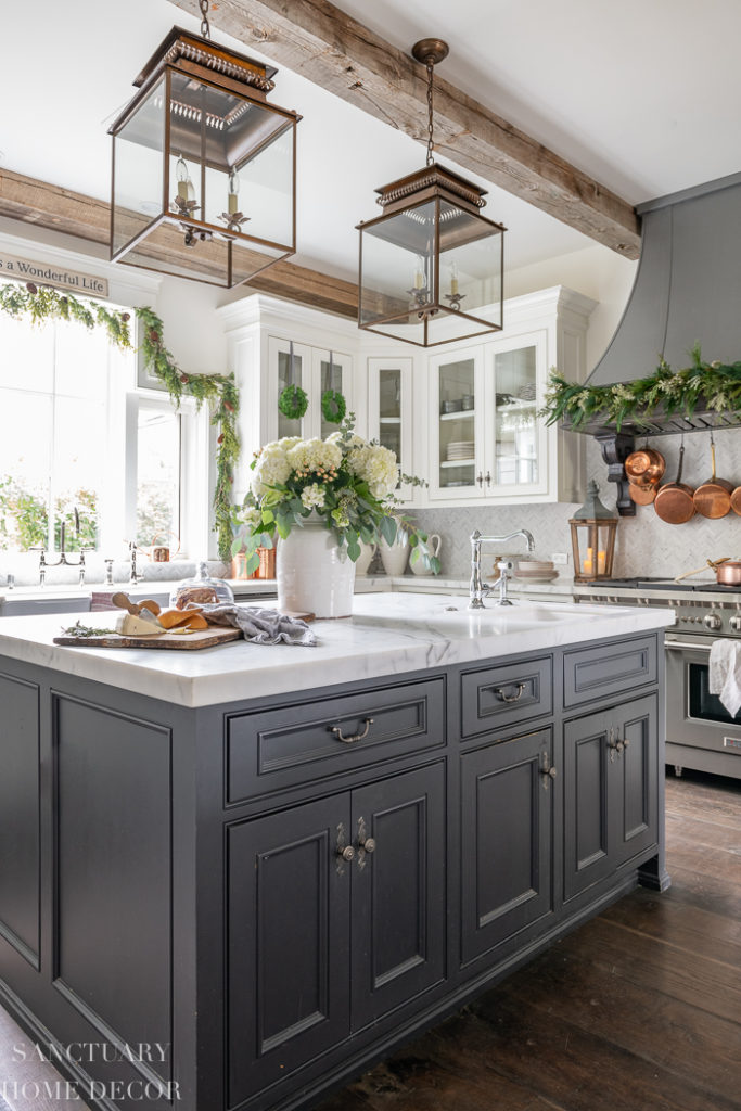 Farmhouse Kitchen Island with Voluminous Floral Arrangement and Greenery Garland — Christmas Kitchen Decor