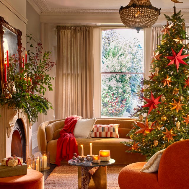 Eclectic Glam Living Room with Bold Red Stars and Orange Sofa Eclectic Glam Living Room with Bold Red Stars and Orange Sofa — christmas decor trends 2026