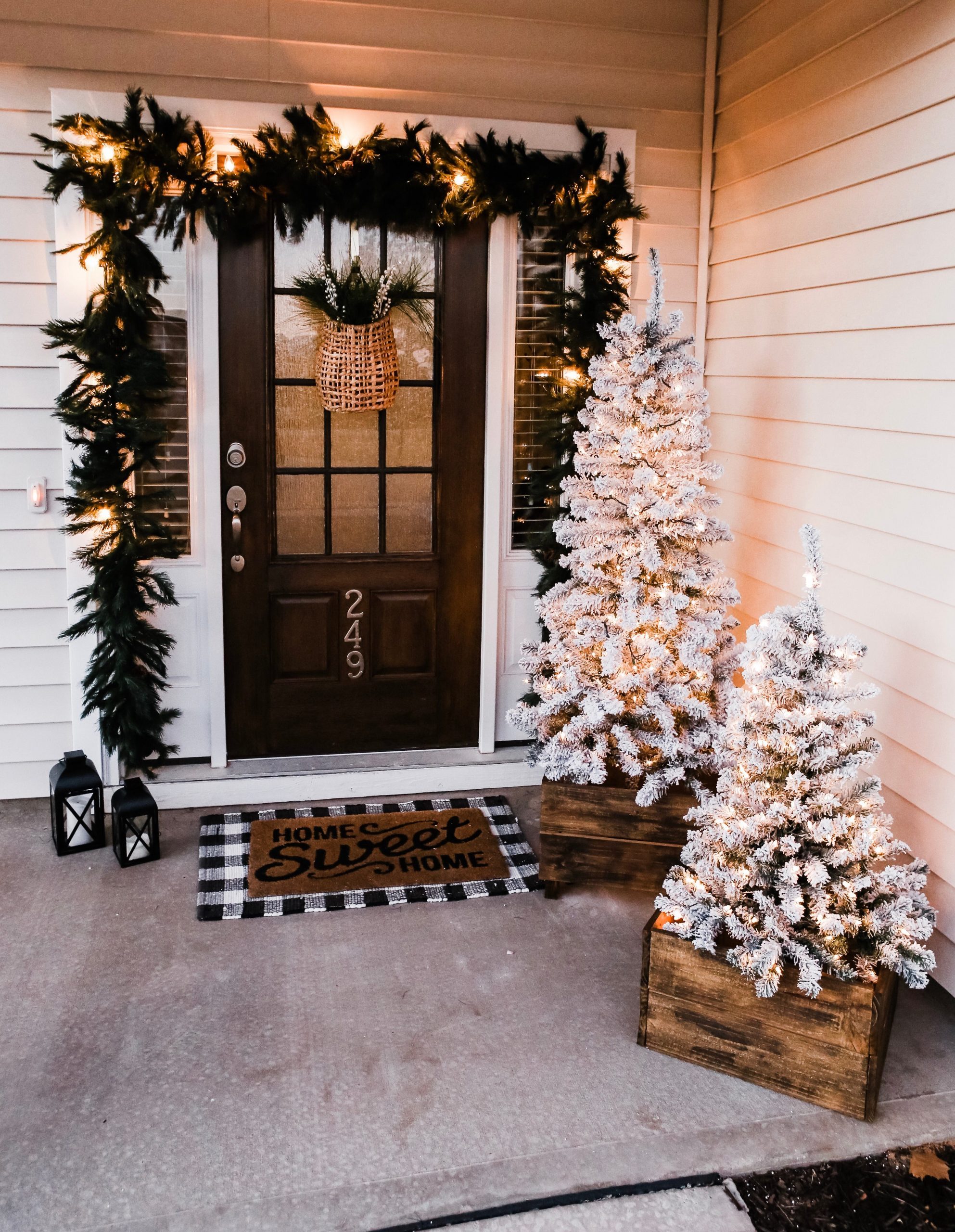 Cozy Porch with Flocked Trees and Garland Lighting — Christmas Yard Decor
