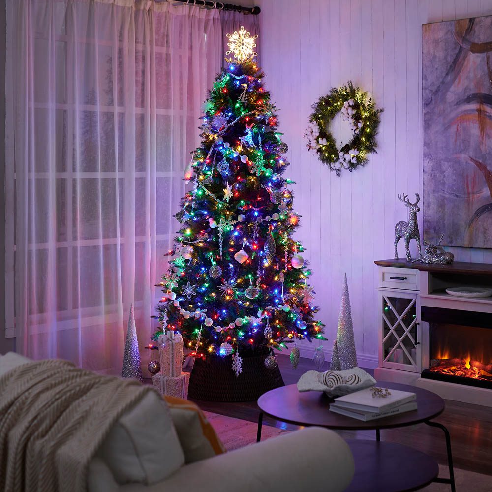 Modern Tree with Snowflake Topper and Multicolor String Lights Modern Tree with Snowflake Topper and Multicolor String Lights — Christmas Tree with Colored Lights
