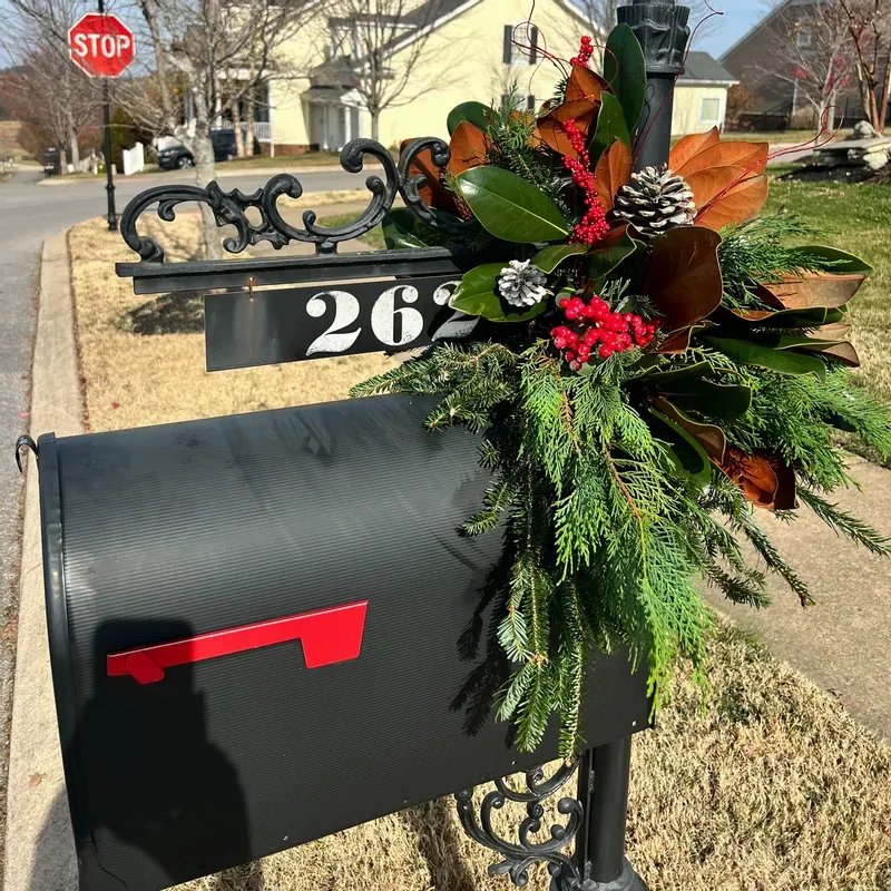 Lush Greenery Swag with Magnolia Leaves and Red Berries on Black Mailbox — Christmas Mailbox Decor