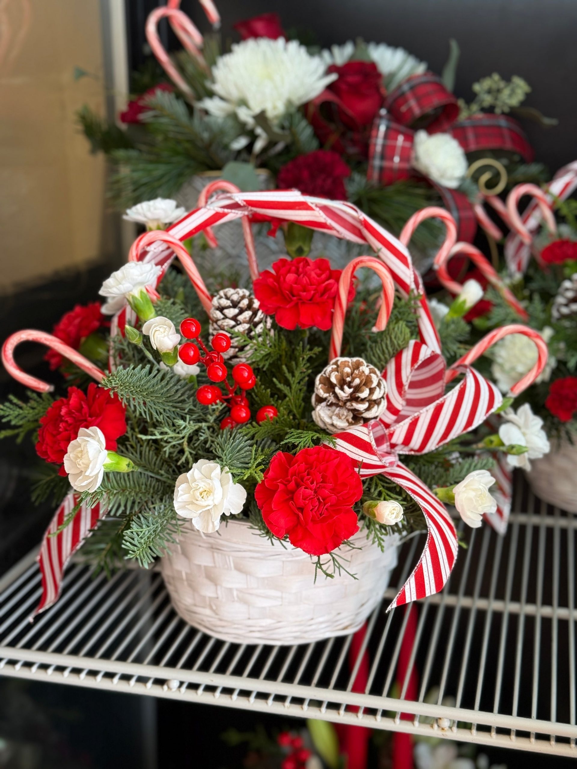 Festive Floral Arrangement with Candy Canes in Wicker Basket — Candy Cane Christmas Decor