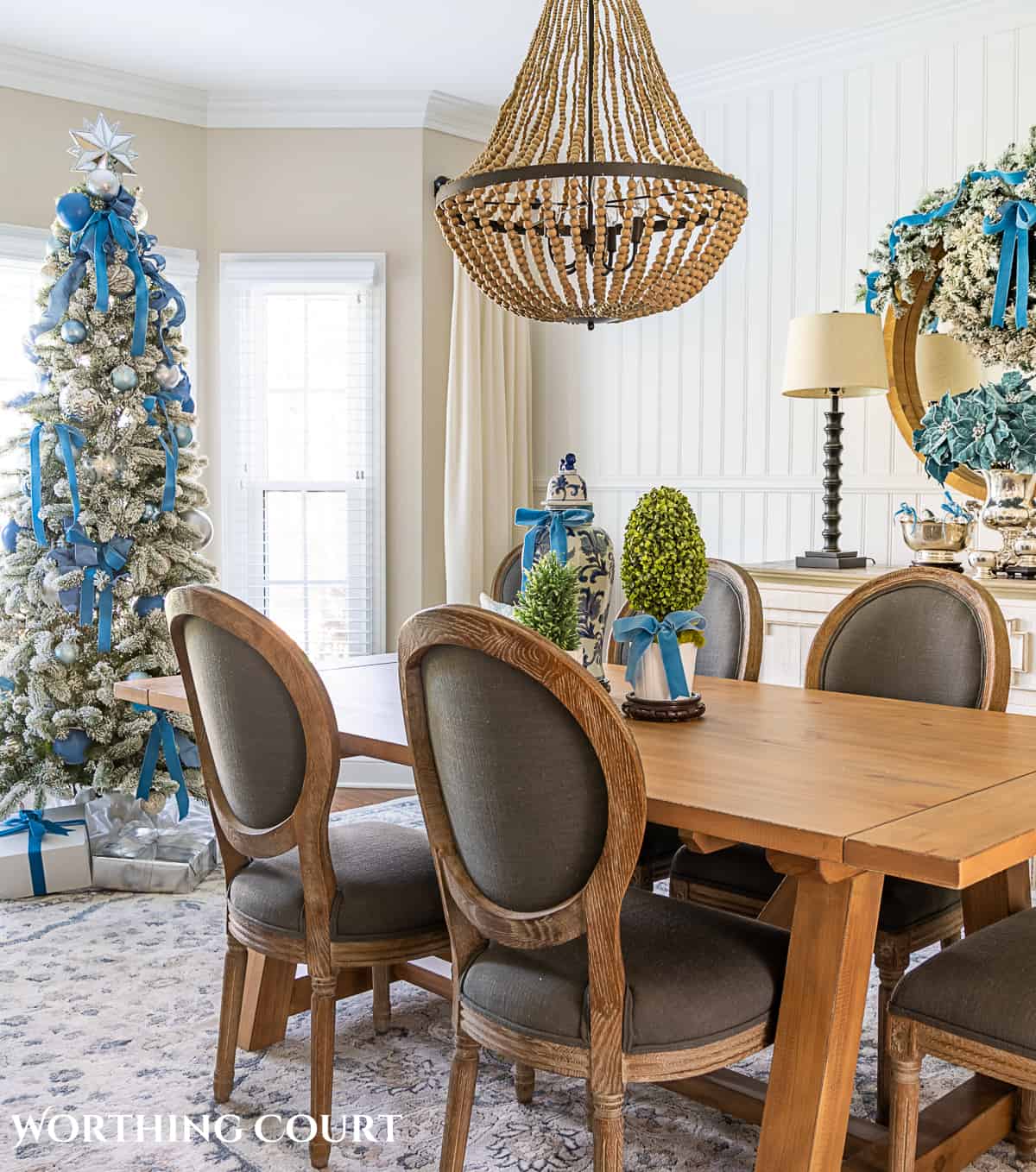 Traditional Christmas Dining with a Blue and Silver Flocked Tree — Christmas Dining Room Decor