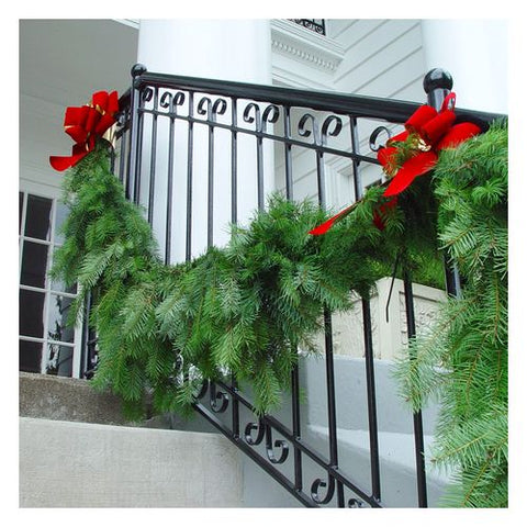 Evergreen Garland with Bold Red Bows on Banister Evergreen Garland with Bold Red Bows on Banister — Christmas Garland