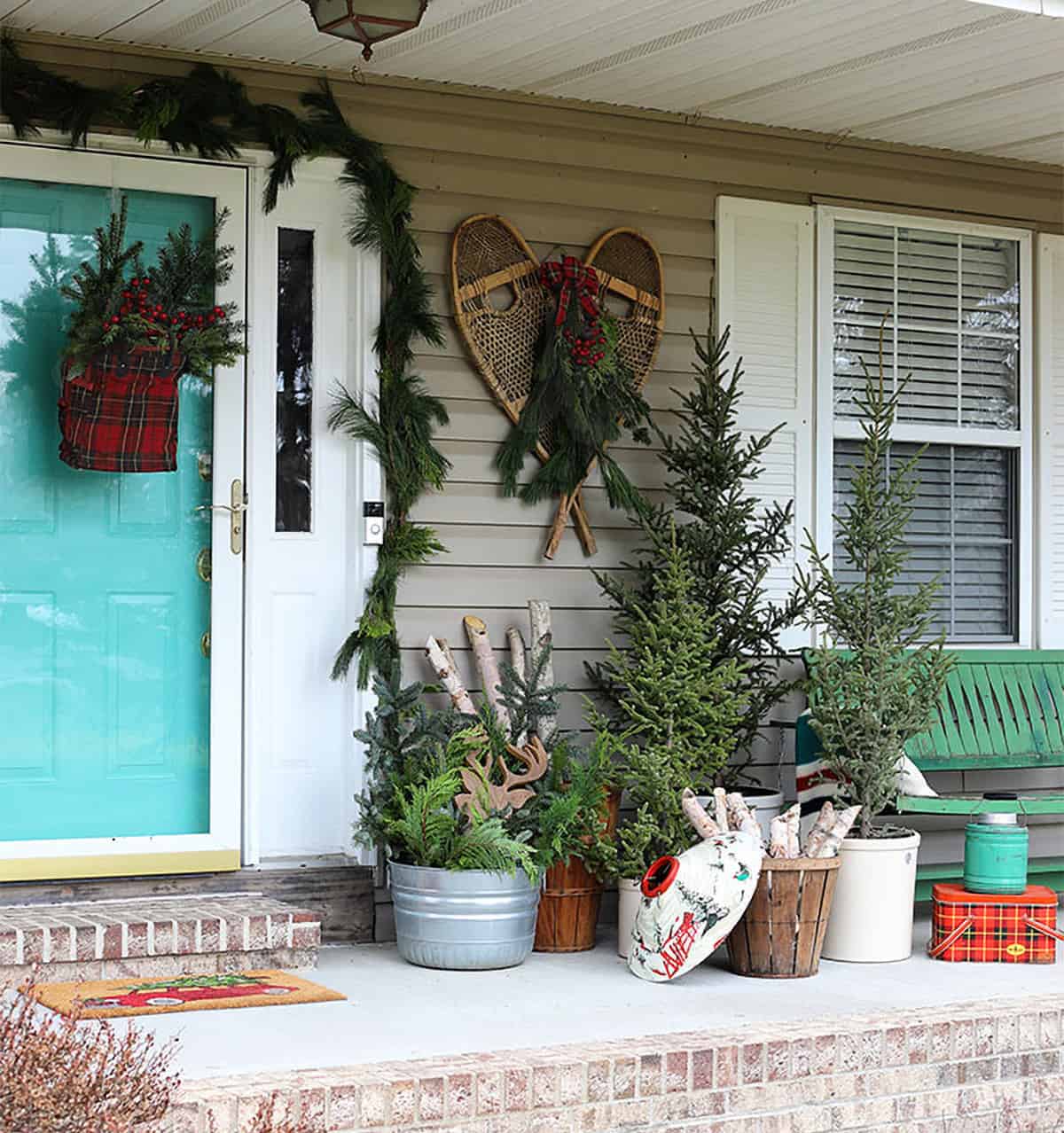 Rustic Porch with Potted Trees and Snowshoes — Simple Christmas Outdoor Decor