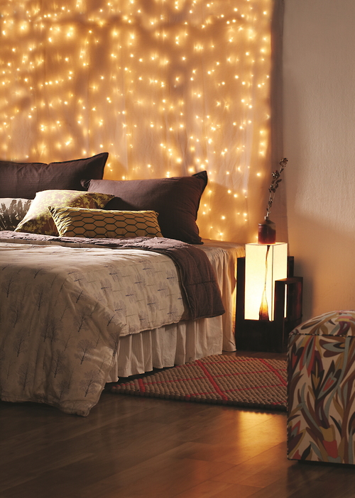 Bedroom with a Wall of Fairy Lights Creating a Glowing Headboard Effect — Christmas Fairy Lights Headboard