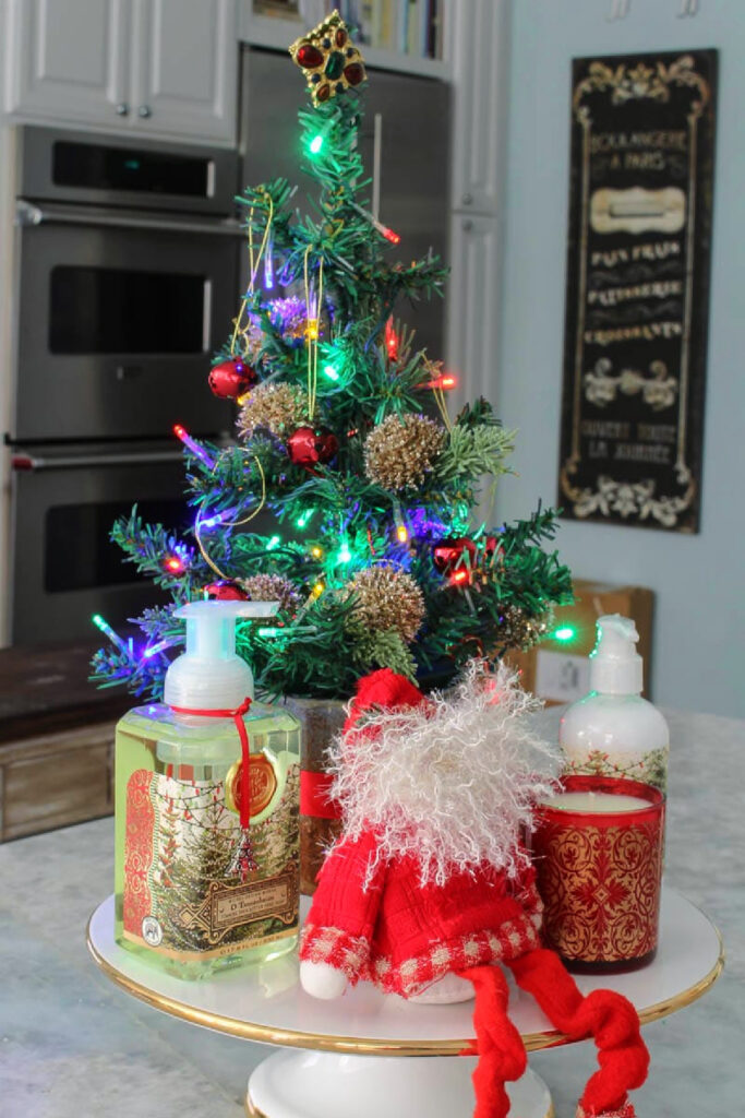 Kitschy Lit Miniature Christmas Tree on a Cake Stand — Dollar Tree Christmas Decor