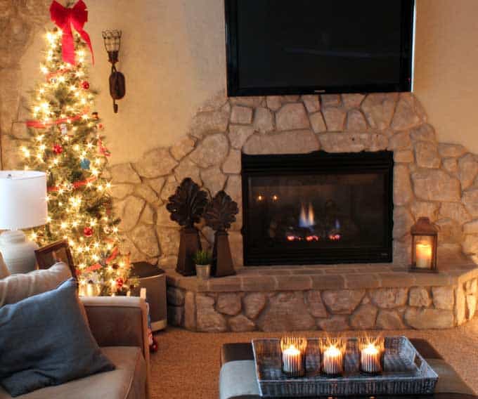 Cozy Living Room with Stone Fireplace and Tree Lights — Christmas Lights Indoor