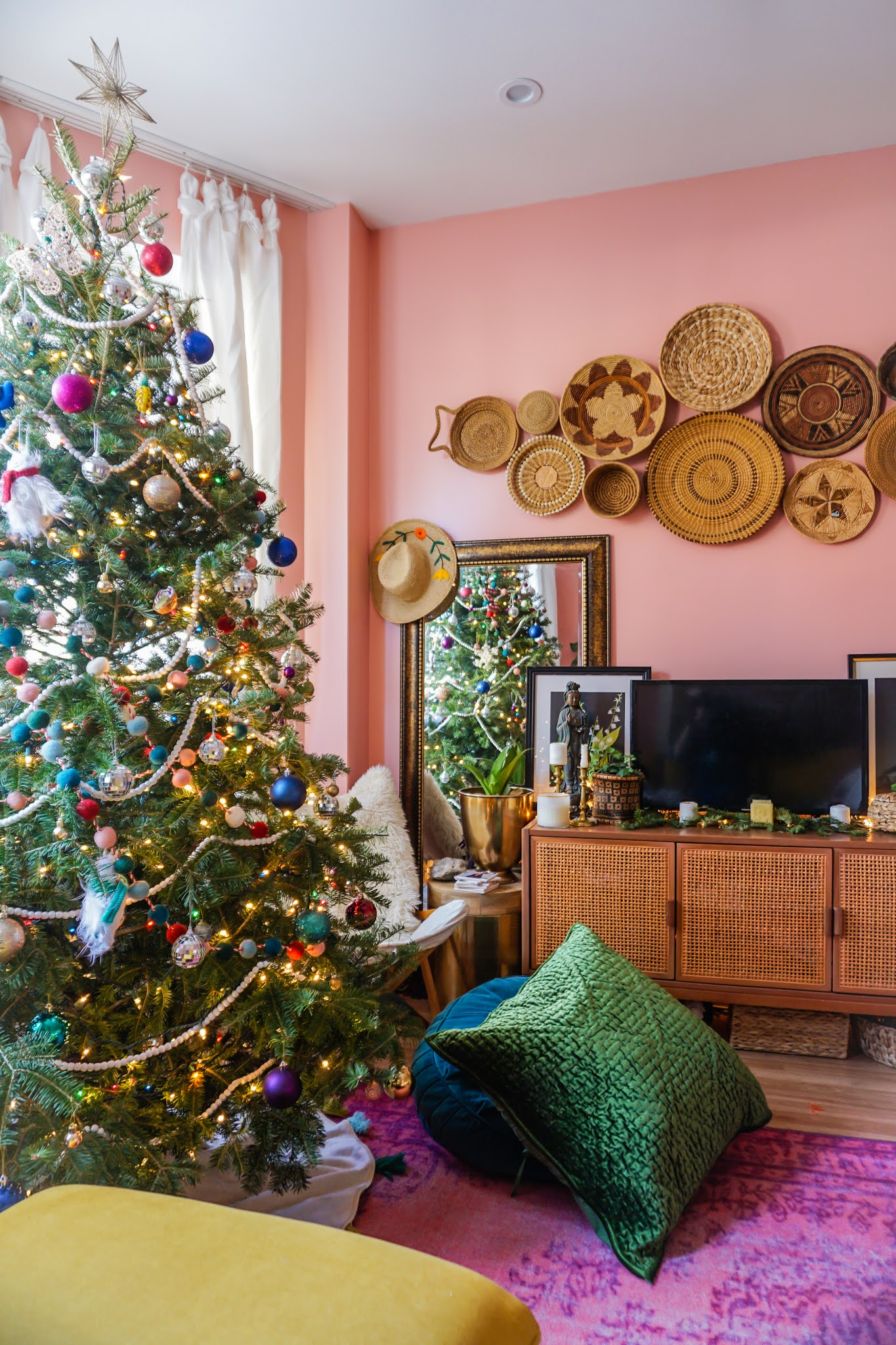 Boho Living Room with Vibrant Pink Tree and Rattan — Boho Christmas Decor