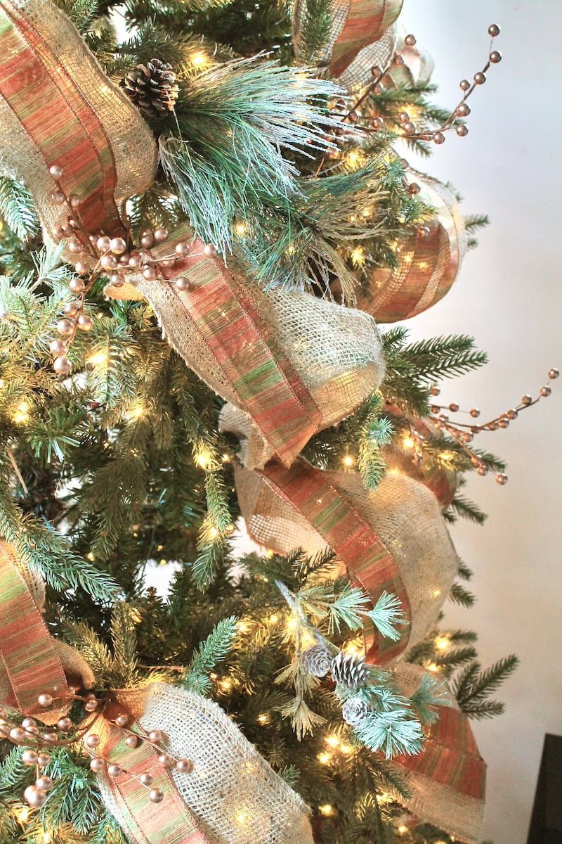 Rustic Christmas Tree Details with Burlap Ribbon and Pinecones — Winter Wonderland Christmas Decor