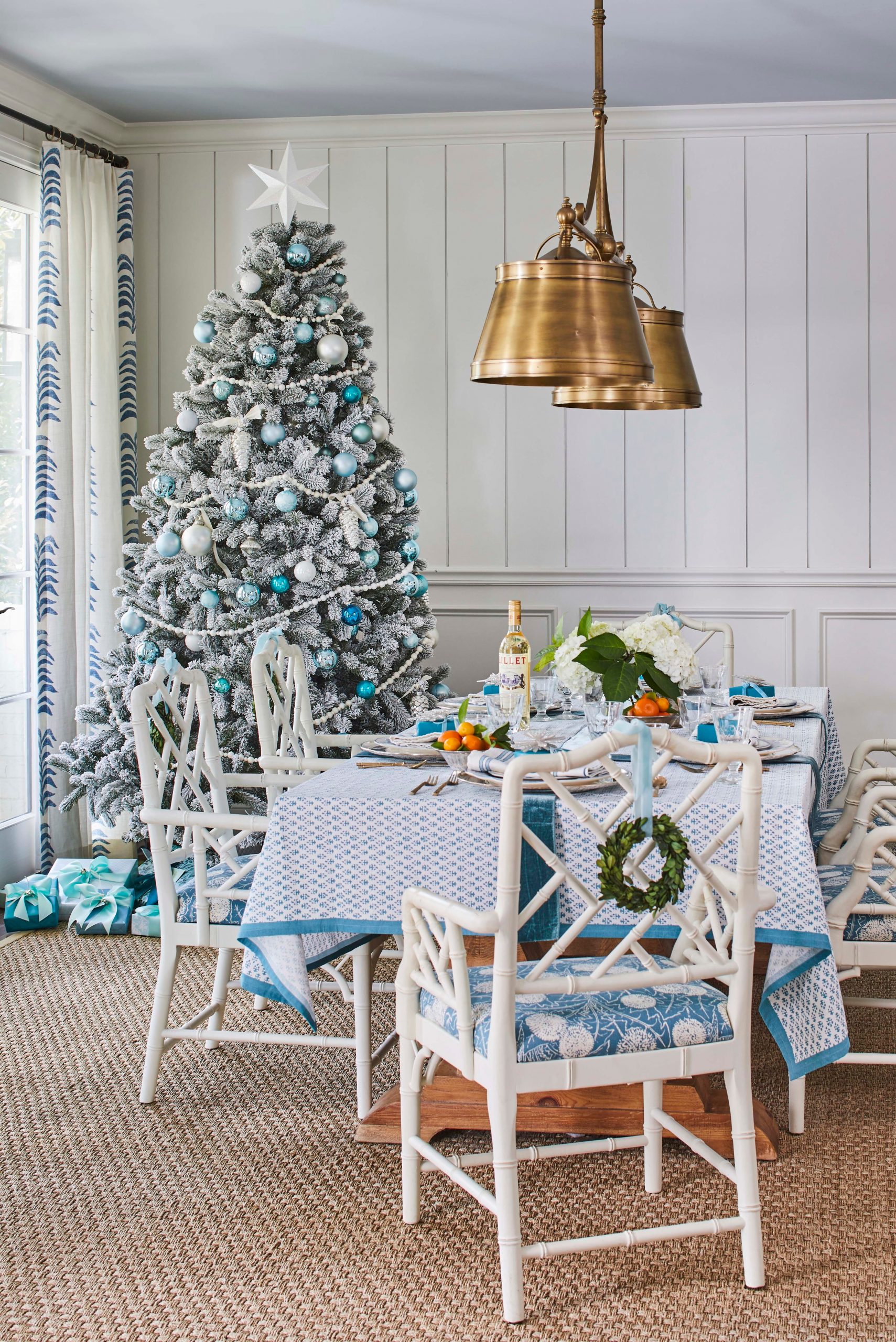 Elegant Dining Room with a Blue and White Flocked Tree Centerpiece Elegant Dining Room with a Blue and White Flocked Tree Centerpiece — Cozy Christmas Decor
