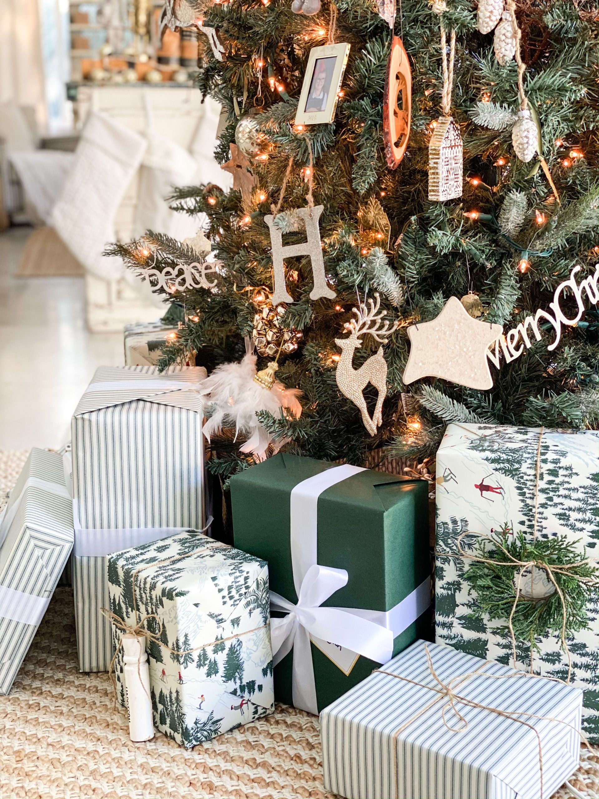 Mixed Patterned Gifts with White Ribbon Under the Tree — Christmas Gift Wrapping